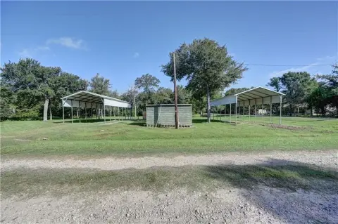 Corner Recreation Lot With Covered RV Structures