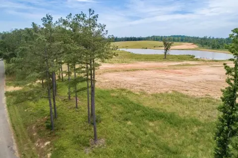 Level Cleared Acreage with Pond Access