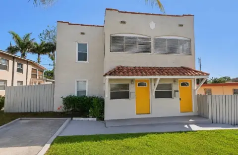 Spanish-Style Duplex With Garages