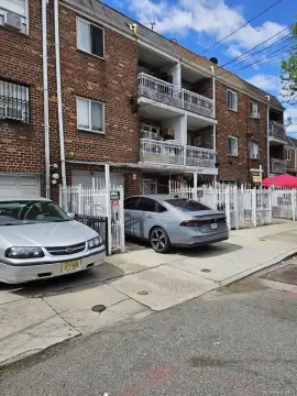 Corona Three-Family Brick Residence