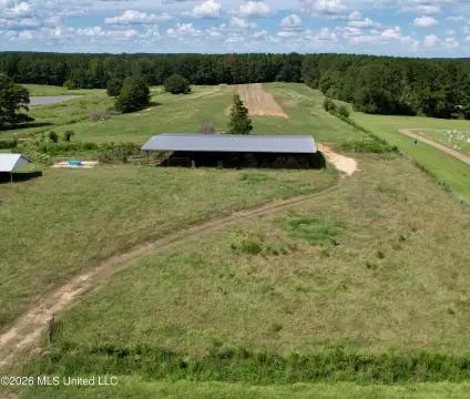 Fenced Farmland with Hay Barn