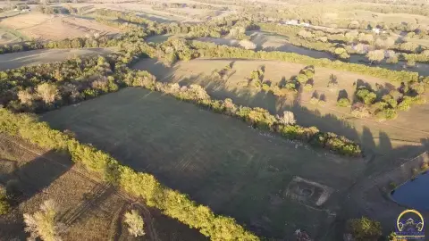 64-Acre Holton Land with Pond