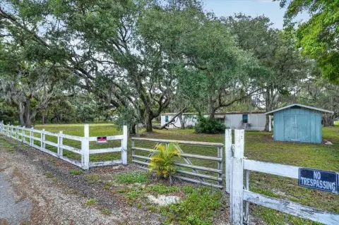 Improved Equestrian Acreage with Pond