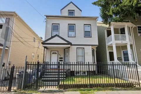 Renovated Two-Family Home with Third-Floor Bonus