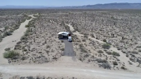 Land with Tiny Cabin
