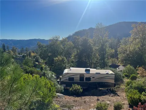 Land with Improvements and RV