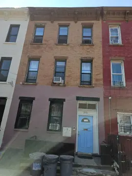 Attached Brick Three-Family Home