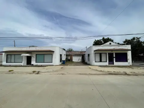 Storefront Property with Flat Metal Roof