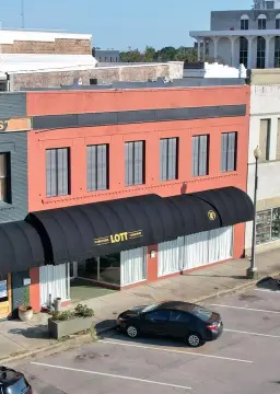 Iconic Laurel Building with Potential