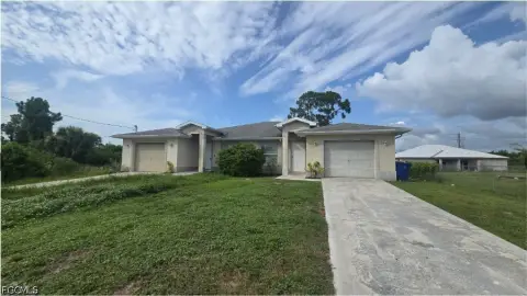 Vacant Duplex With Two Garages