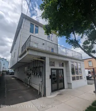 Three-Story Multifamily Building with Commercial Unit