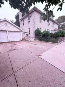 Two-Family Duplex with Detached Garages