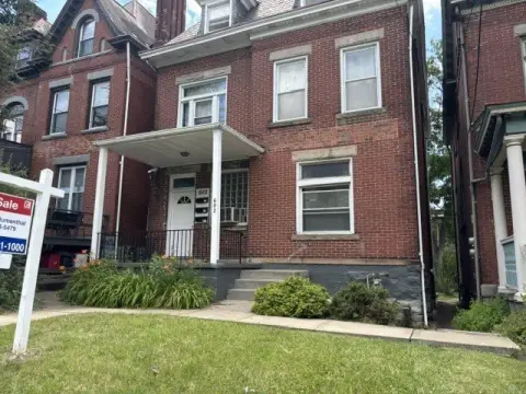 Brick Triplex with Flat Backyard