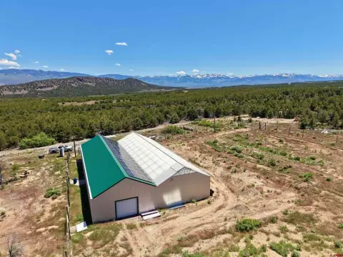 Mountain Land with Large Building