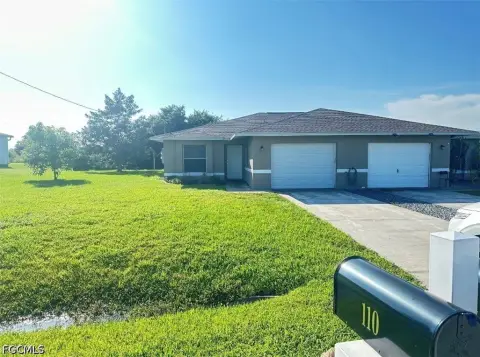 Tile-Finished Duplex with Garages