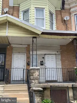 Porch-Front Duplex Residence