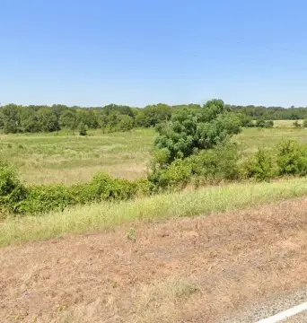 Farmland with Creek and Pond