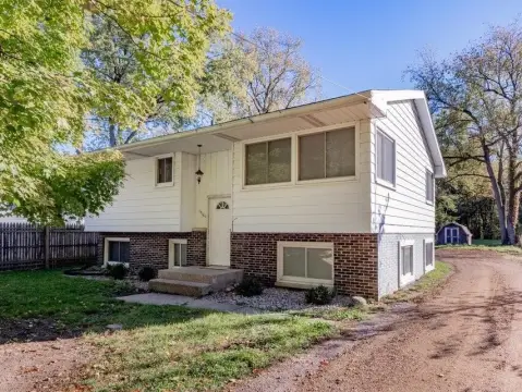 Two-Unit Duplex With Storage Sheds