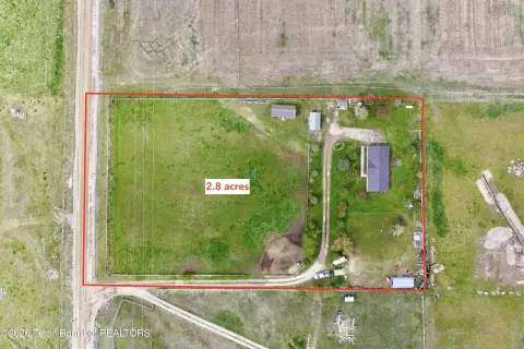 Land With Single-Family Home