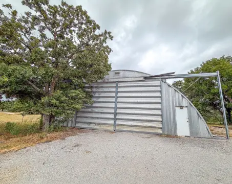 Metal Warehouse with Gravel Parking