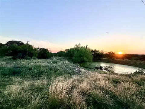 Fenced Acreage with Creek and Pond