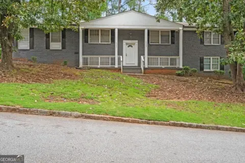 Updated Quadplex with Top-Floor Unit