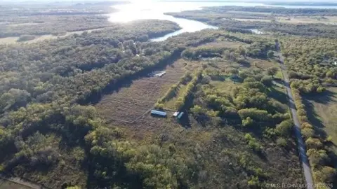 Cleared Land with Greenhouse Frames