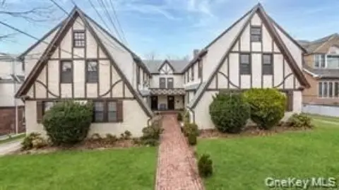 Douglaston Tudor-Style 8-Family Building