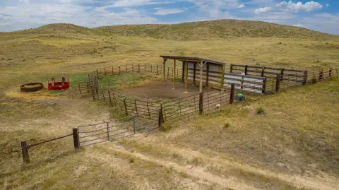 Fully Fenced Prairie Acreage with Pond