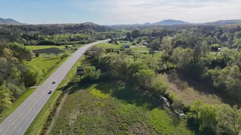 Land with Creek Near Town