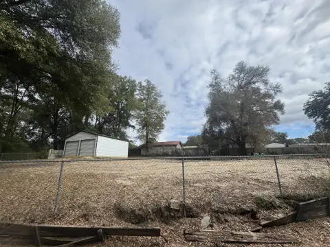 Vacant Lot with Steel Workshop Building