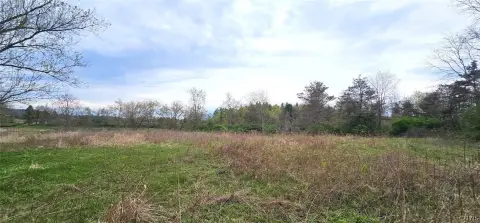 Secluded Land Borders Golf Course