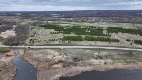 Land with River and Highway Frontage