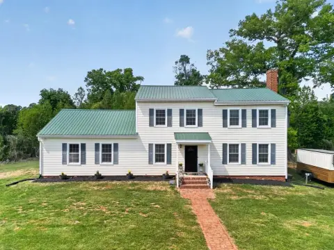 Updated Farmhouse on Private Acreage
