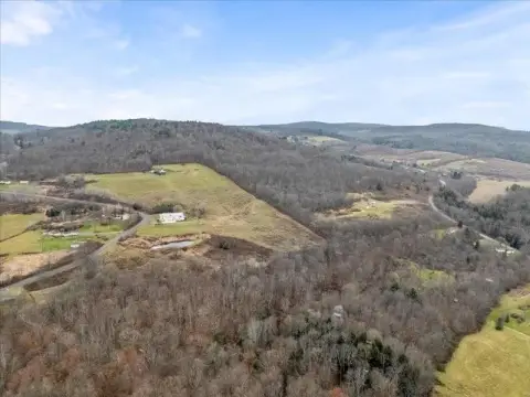 Land with Cabin