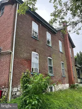 Colonial Duplex with Attached Apartment