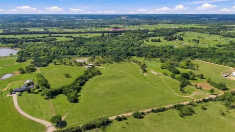 Wooded Ranch with Creek and Pond