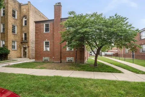 Four-Unit Brick Quadplex with Carport