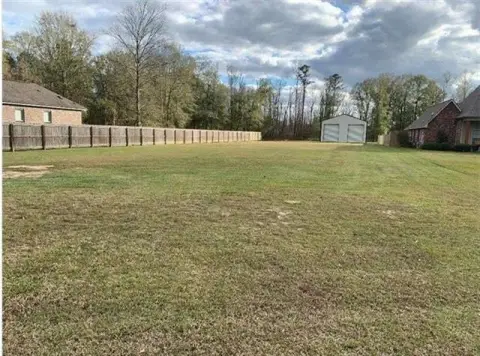 Land with Metal Workshop Building
