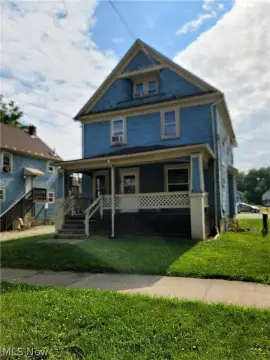 Triplex with Driveway and Parking Lot