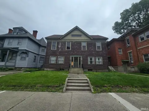 Vacant Eightplex with Carriage House