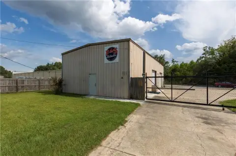 Fenced Warehouse with Roll-Up Doors