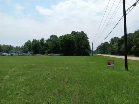 Commercial Land with Unfinished Metal Building
