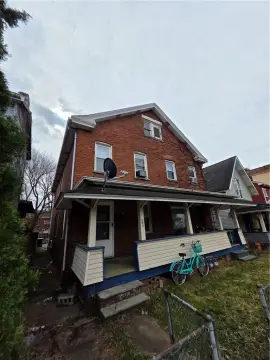 Brick Duplex with Covered Porches