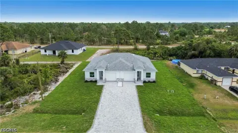 Two-Unit Duplex with Screened Lanais