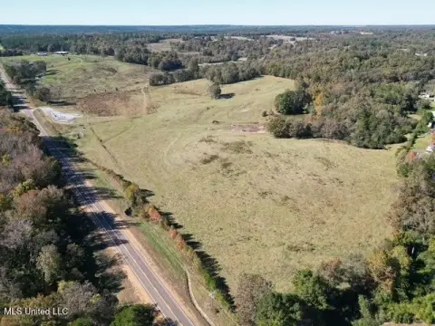 Fenced Farmland with Pond