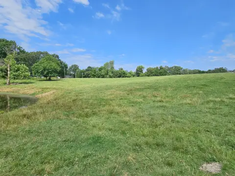 Fenced Farmland with Pond