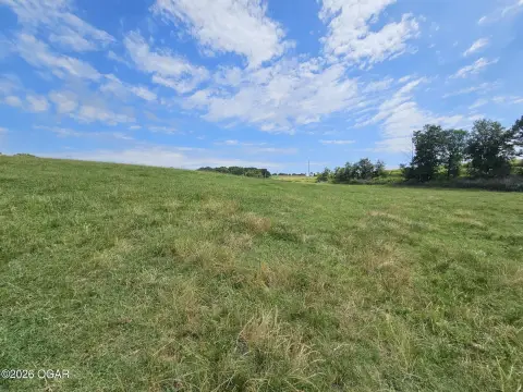 Pastureland with Pond and Fencing