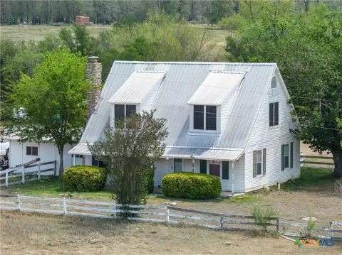 Farmhouse on Fenced Acreage