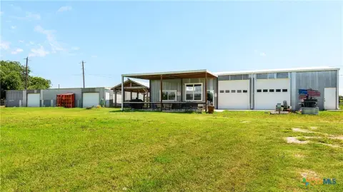 Two Metal Flex Buildings with Covered Patio